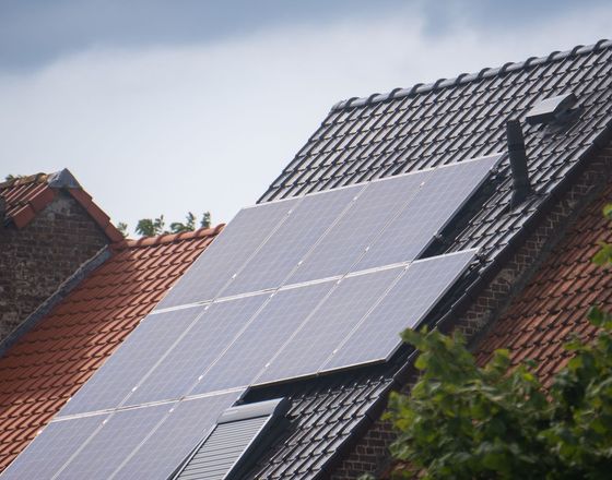 Solar panels on a tiled roof in the sunshine